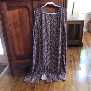 Maxi Loft dress based in black with multi colored flowers. Slit in front